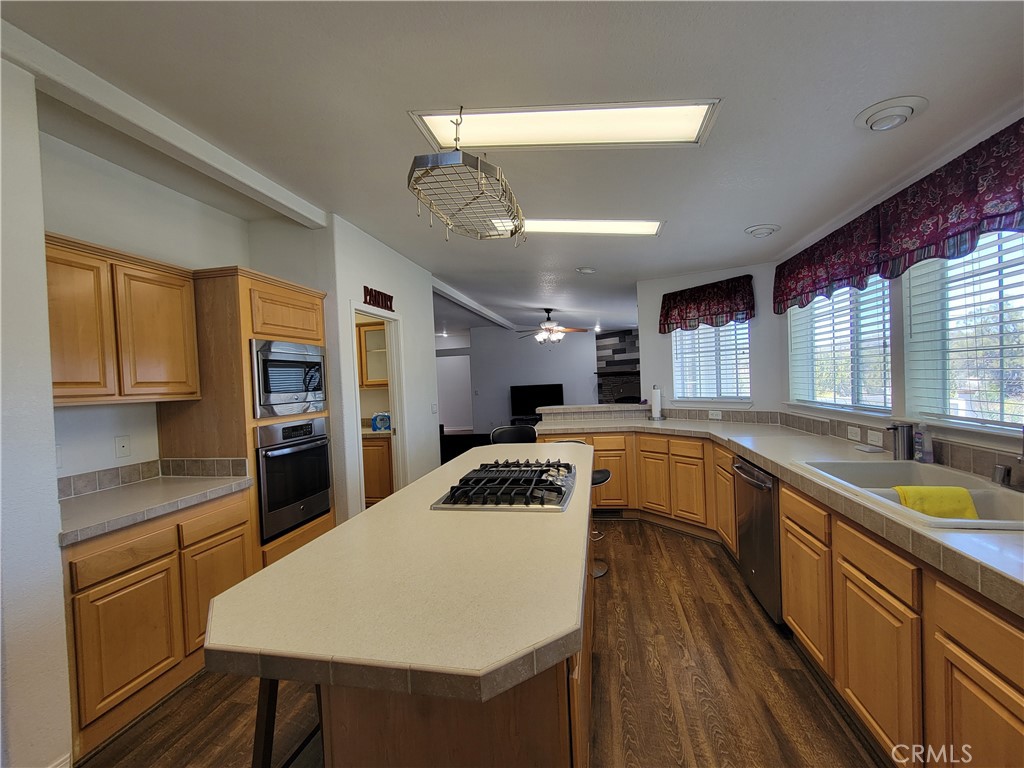 58804 Ramsey Road Anza, CA 92539 - Photo 13 of 51 a kitchen with a table chairs sink and cabinets