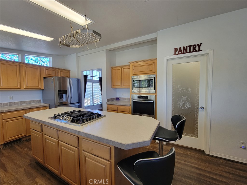 58804 Ramsey Road Anza, CA 92539 - Photo 14 of 51 a kitchen with a appliances a stove a counter top space and cabinets