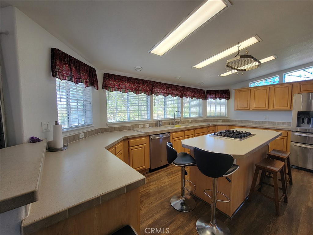 58804 Ramsey Road Anza, CA 92539 - Photo 15 of 51 a kitchen with stainless steel appliances granite countertop a sink a stove and a refrigerator