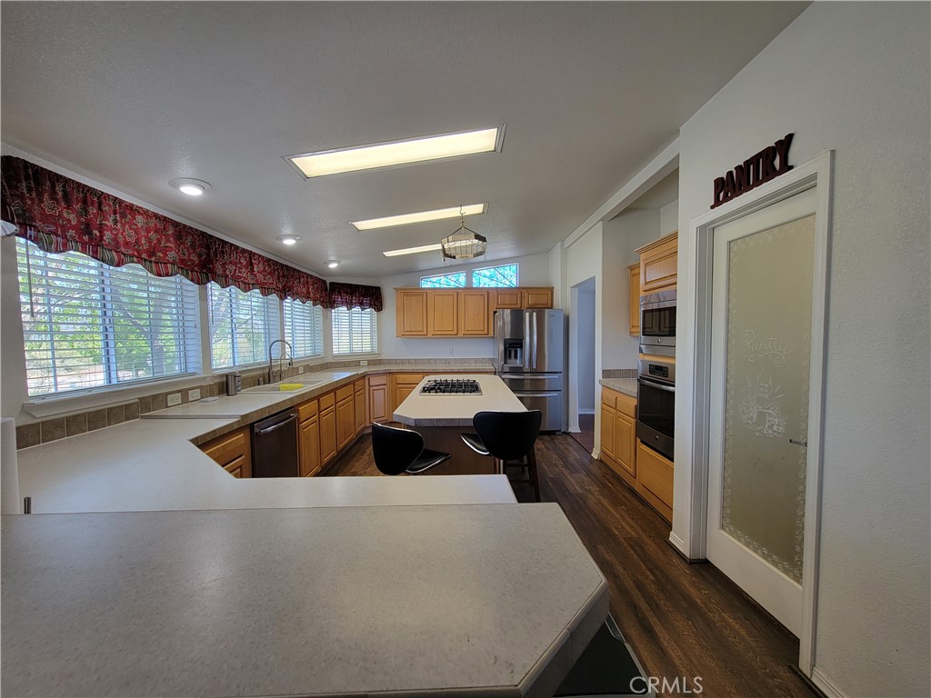 58804 Ramsey Road Anza, CA 92539 - Photo 17 of 51 a large white kitchen with a large window
