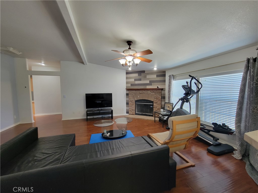 58804 Ramsey Road Anza, CA 92539 - Photo 18 of 51 a living room with furniture a fireplace and a flat screen tv