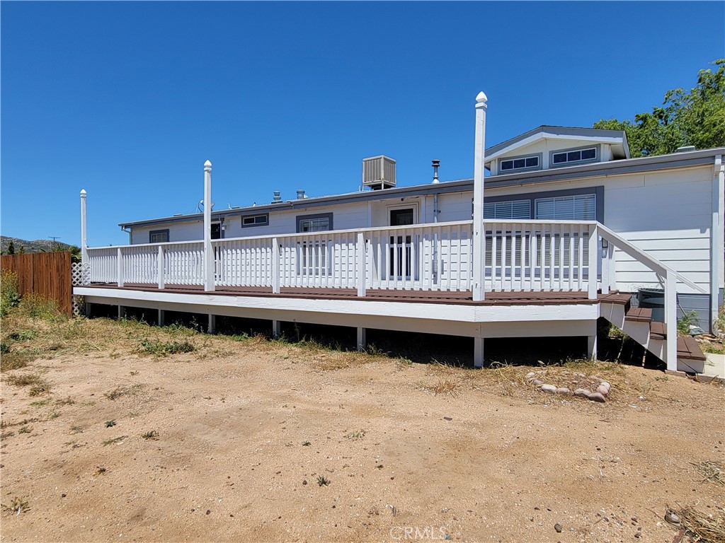 58804 Ramsey Road Anza, CA 92539 - Photo 2 of 51 a view of a house with wooden deck and a yard