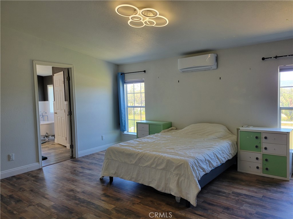 58804 Ramsey Road Anza, CA 92539 - Photo 23 of 51 a bedroom with a bed and window