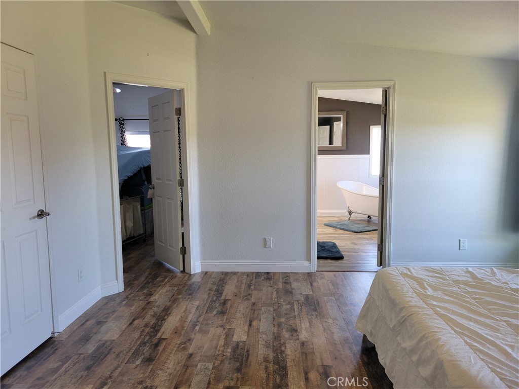 58804 Ramsey Road Anza, CA 92539 - Photo 24 of 51 a bedroom with a bed and view of bathroom