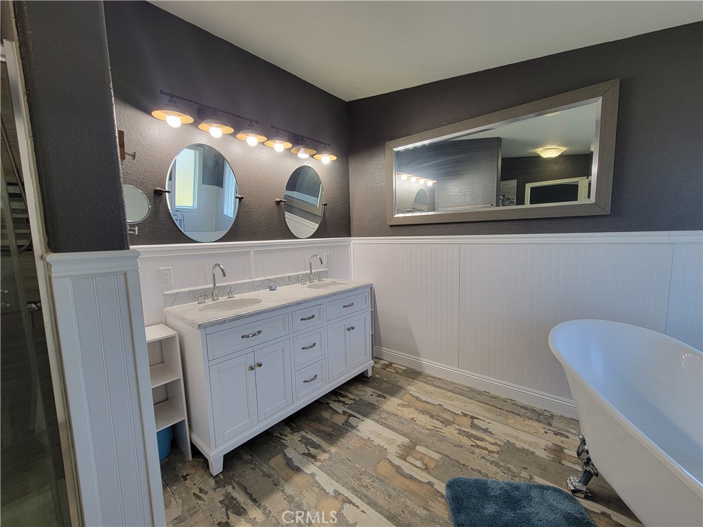 58804 Ramsey Road Anza, CA 92539 - Photo 28 of 51 a bathroom with a sink mirror and vanity