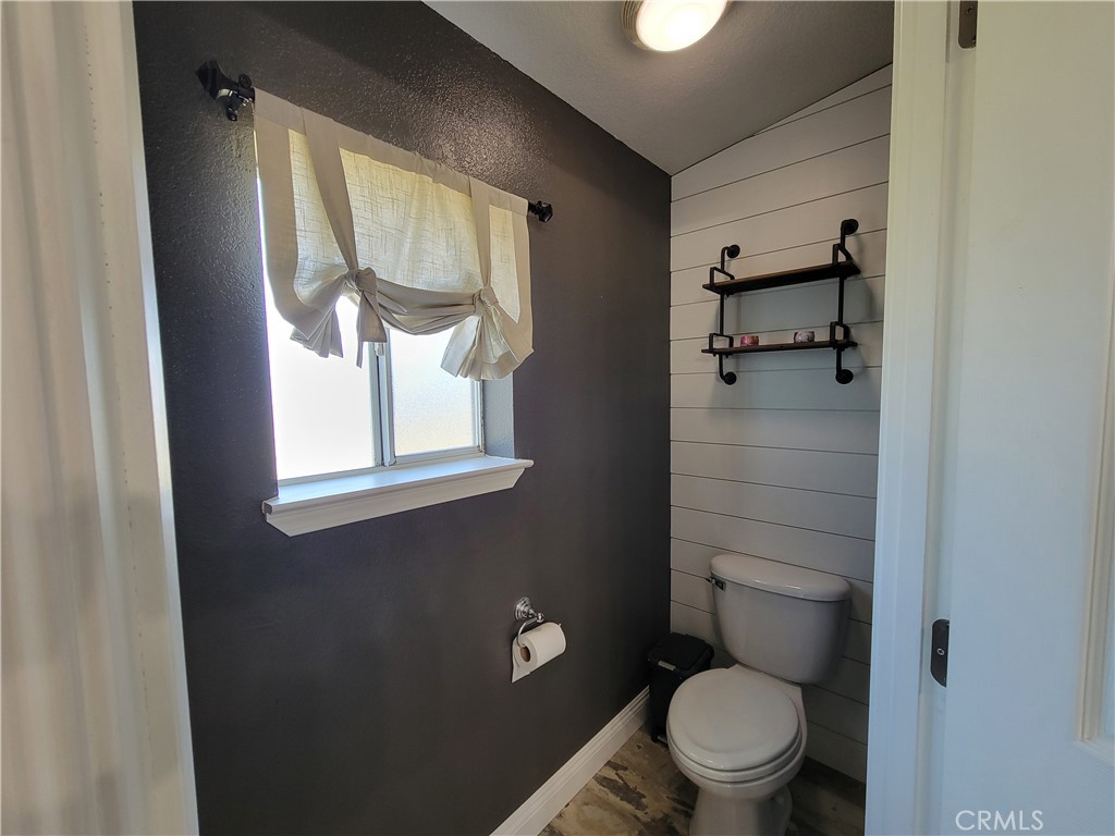 58804 Ramsey Road Anza, CA 92539 - Photo 30 of 51 a white toilet sitting next to a bathroom sink