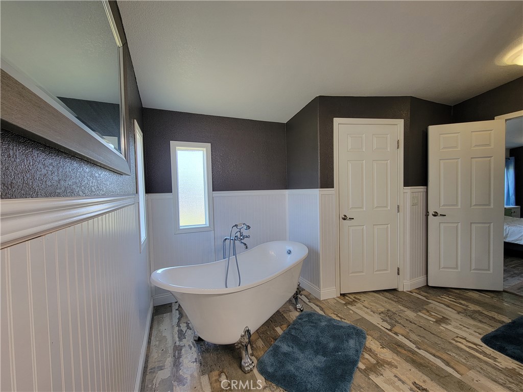58804 Ramsey Road Anza, CA 92539 - Photo 31 of 51 a spacious bathroom with a bathtub and shower