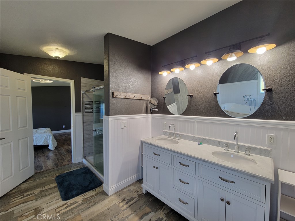 58804 Ramsey Road Anza, CA 92539 - Photo 32 of 51 a bathroom with double vanity and a mirror