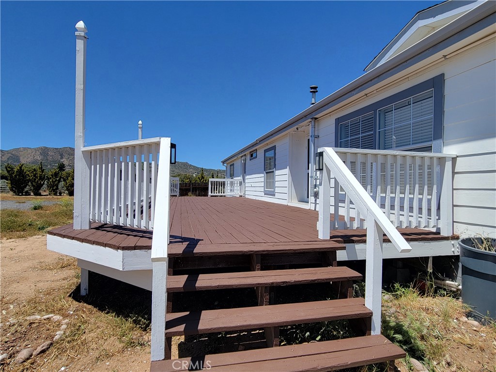 58804 Ramsey Road Anza, CA 92539 - Photo 34 of 51 a view of a balcony with wooden floor and outdoor seating