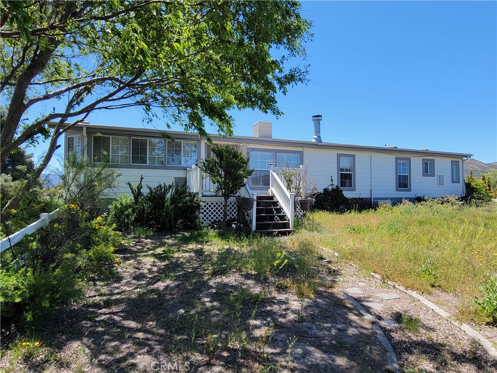 58804 Ramsey Road Anza, CA 92539 - Photo 39 of 51 a view of a house with a yard and tree