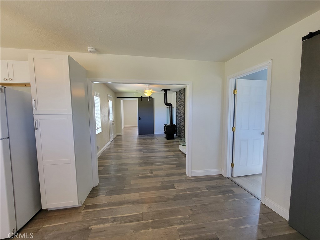 58804 Ramsey Road Anza, CA 92539 - Photo 45 of 51 a view of a hallway with wooden floor and staircase