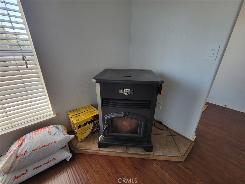 58804 Ramsey Road Anza, CA 92539 - Photo 10 of 51 a living room with a couch and a fireplace