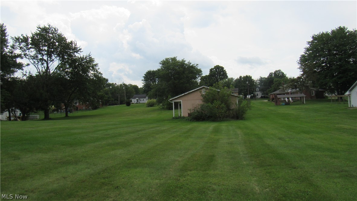6841 Navarre Road Southwest Massillon, OH 44646 - Photo 47 of 50 Expansive green lawn with mature trees