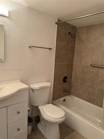 a room with a cabinet and a flat screen tv