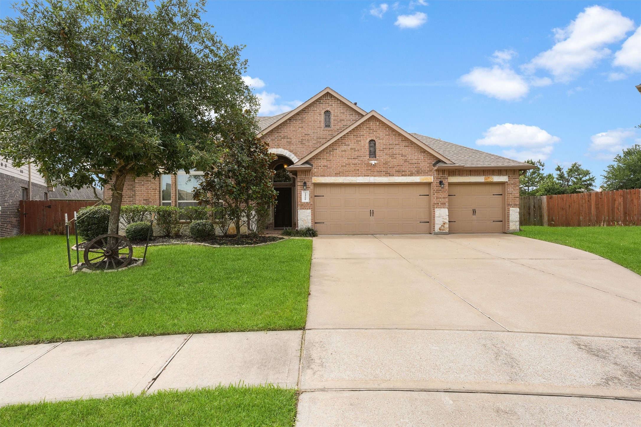a front view of a house with a yard and a garage