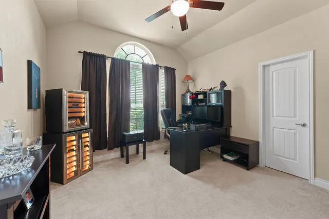a view of a livingroom with furniture and a window