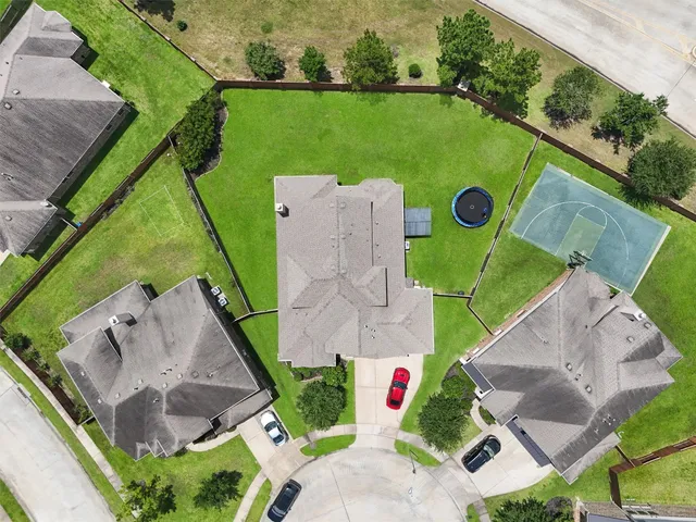 an aerial view of residential houses with outdoor space