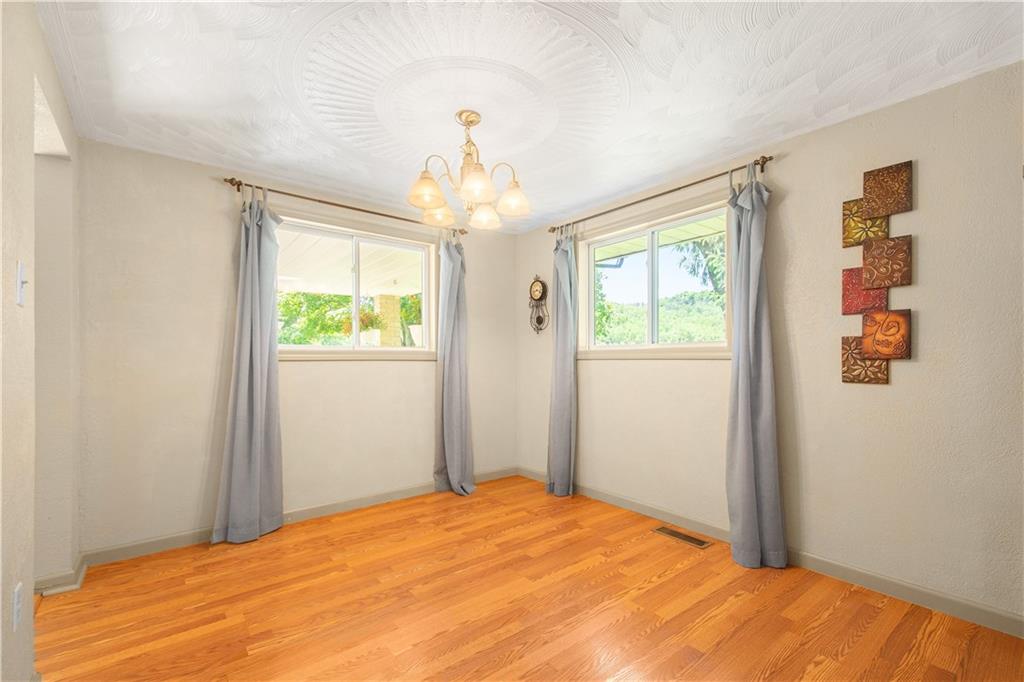 10 Swihart Road Canonsburg, PA 15317 - Photo 16 of 25 Nice Dining room w/laminate hardwood, 2 large windows for natural light, plaster walls