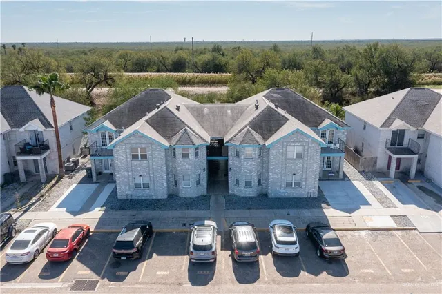 an aerial view of a house with swimming pool