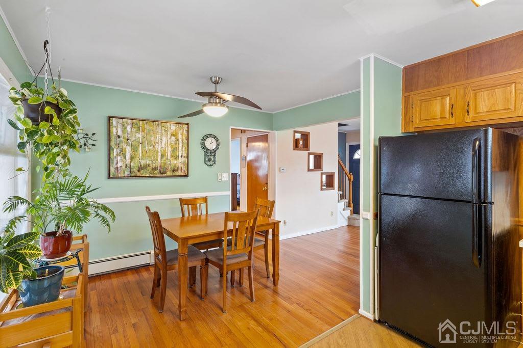 155 East Hill Road Colonia, NJ 07067 - Photo 11 of 37 a view of a dining room with furniture window and wooden floor