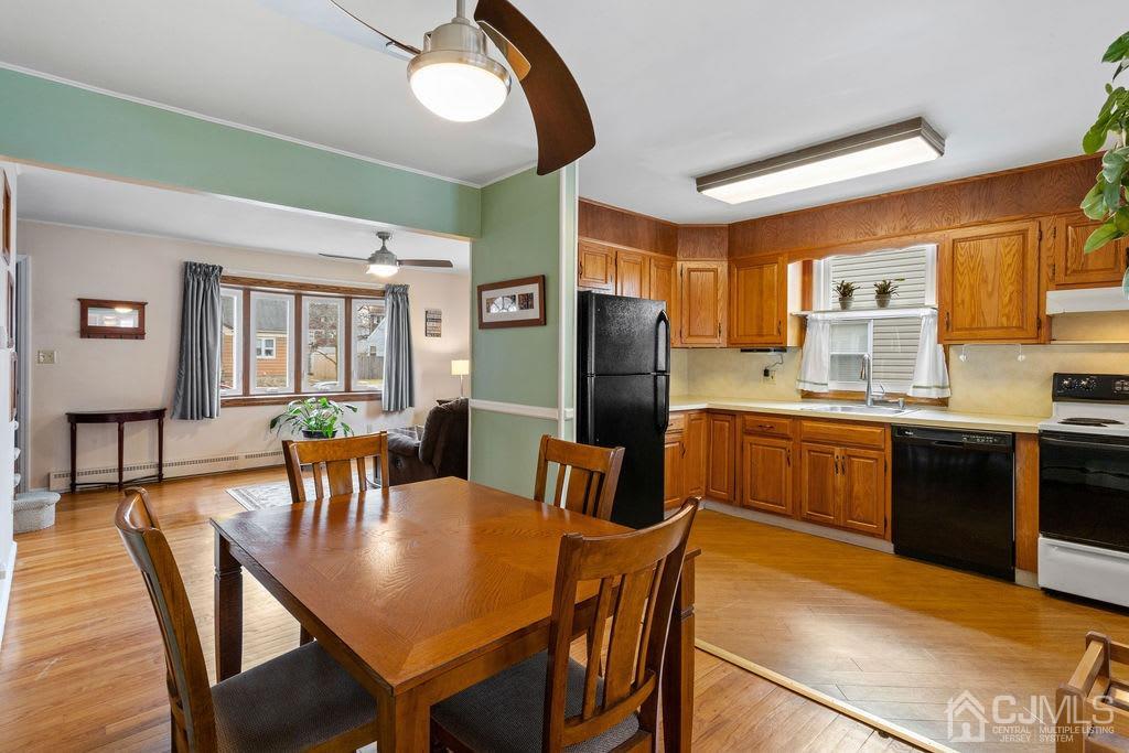 155 East Hill Road Colonia, NJ 07067 - Photo 12 of 37 a view of a dining room with furniture and wooden floor