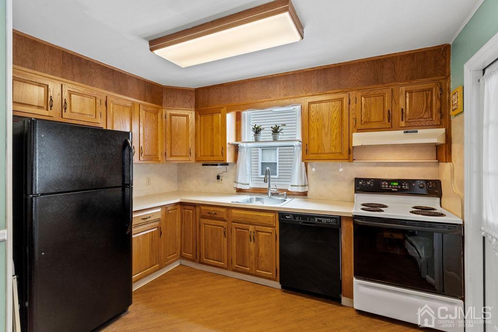 155 East Hill Road Colonia, NJ 07067 - Photo 13 of 37 a kitchen with a sink stove and refrigerator