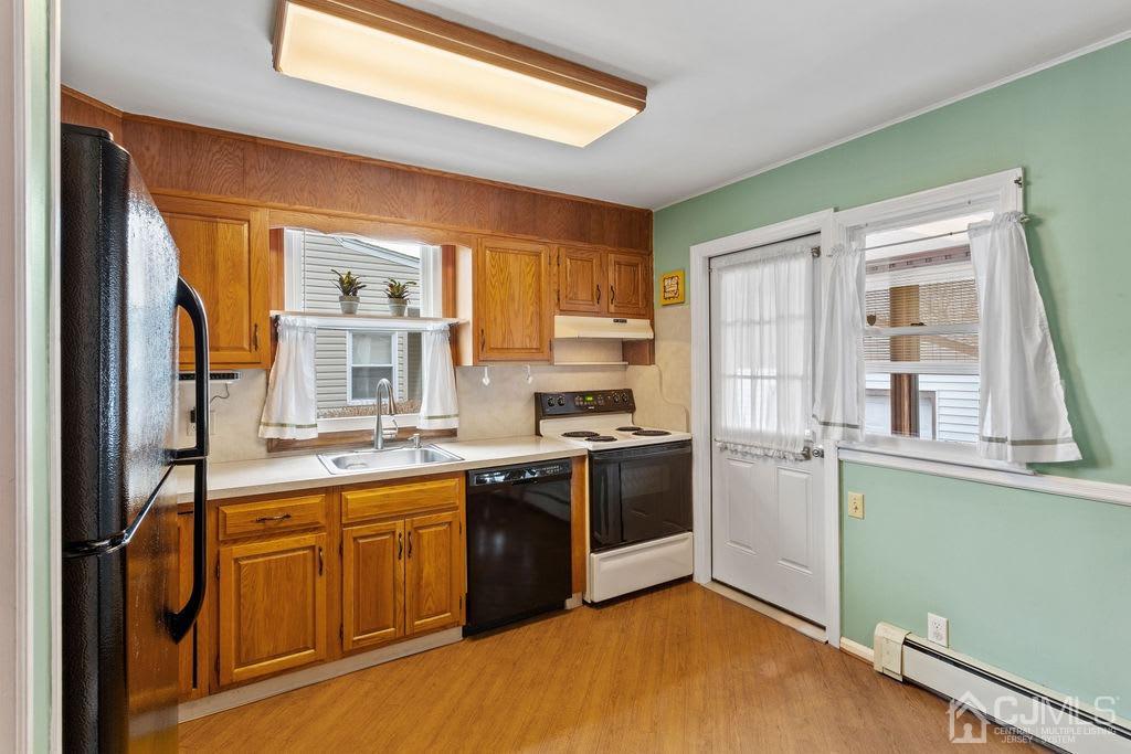 155 East Hill Road Colonia, NJ 07067 - Photo 14 of 37 a kitchen with stainless steel appliances granite countertop a stove and a refrigerator