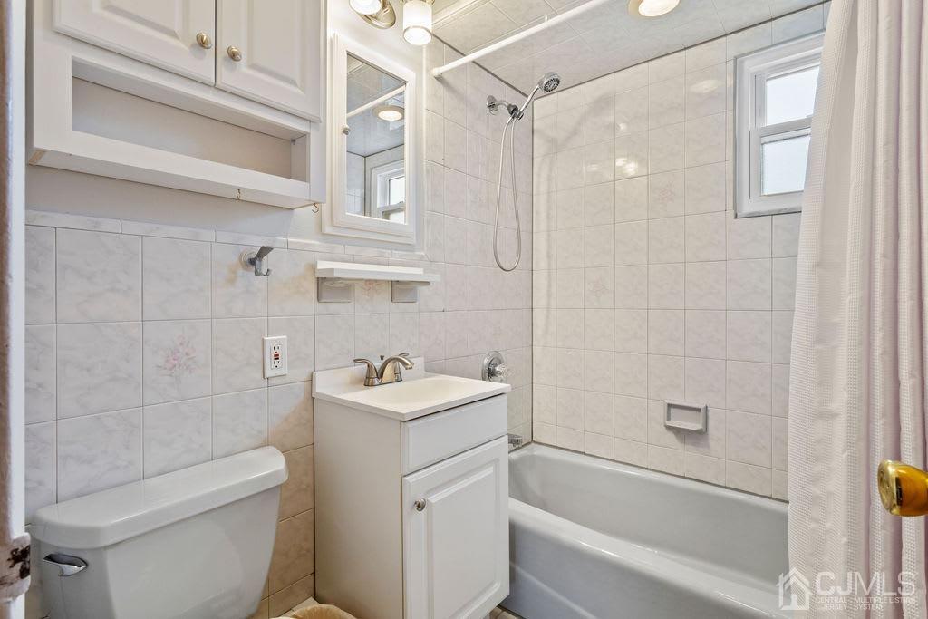 155 East Hill Road Colonia, NJ 07067 - Photo 17 of 37 a bathroom with a sink a toilet and shower