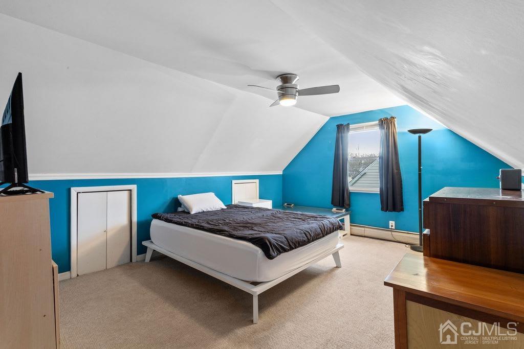 155 East Hill Road Colonia, NJ 07067 - Photo 18 of 37 a spacious bedroom with a bed and a couch