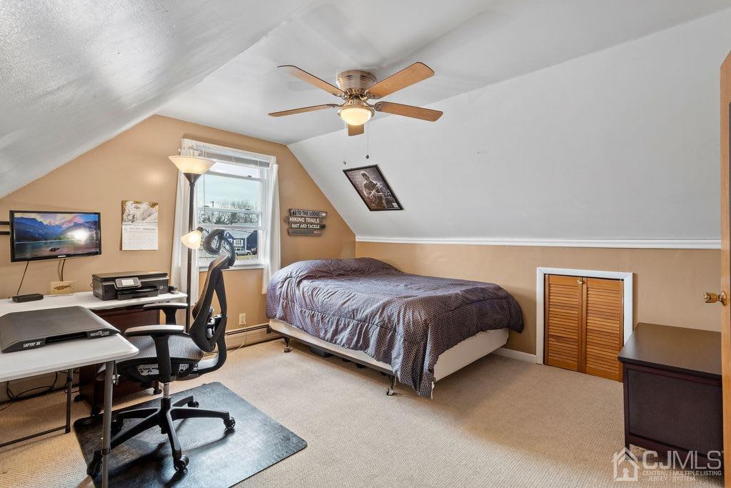 155 East Hill Road Colonia, NJ 07067 - Photo 22 of 37 a bedroom with a bed and a chandelier