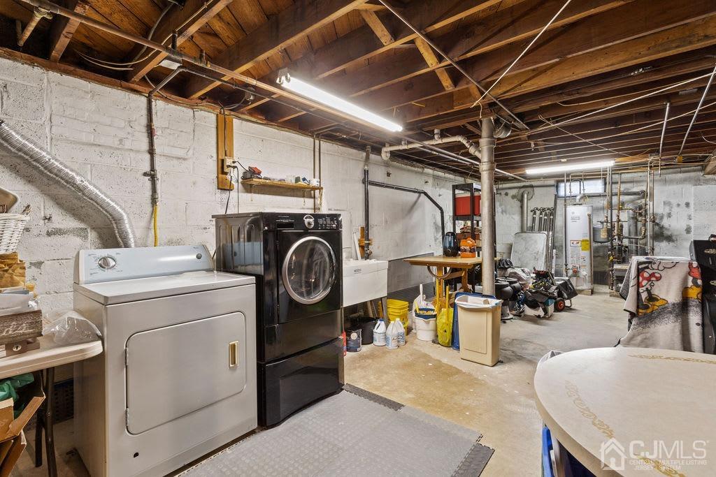 155 East Hill Road Colonia, NJ 07067 - Photo 24 of 37 a utility room with dryer washer and stair