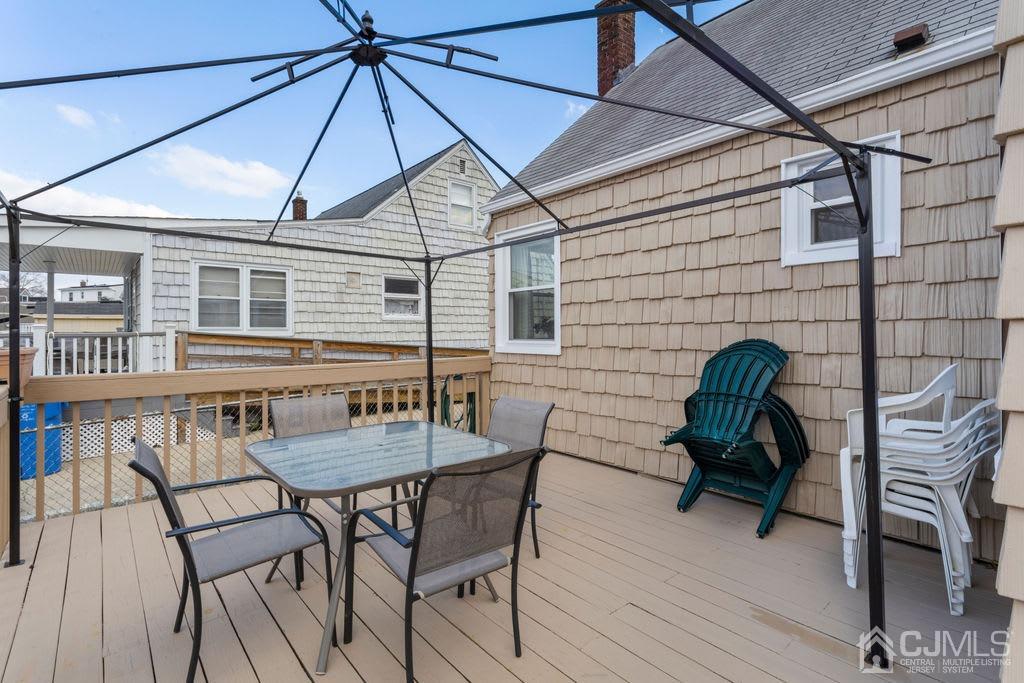 155 East Hill Road Colonia, NJ 07067 - Photo 26 of 37 a view of a roof deck with chair and table
