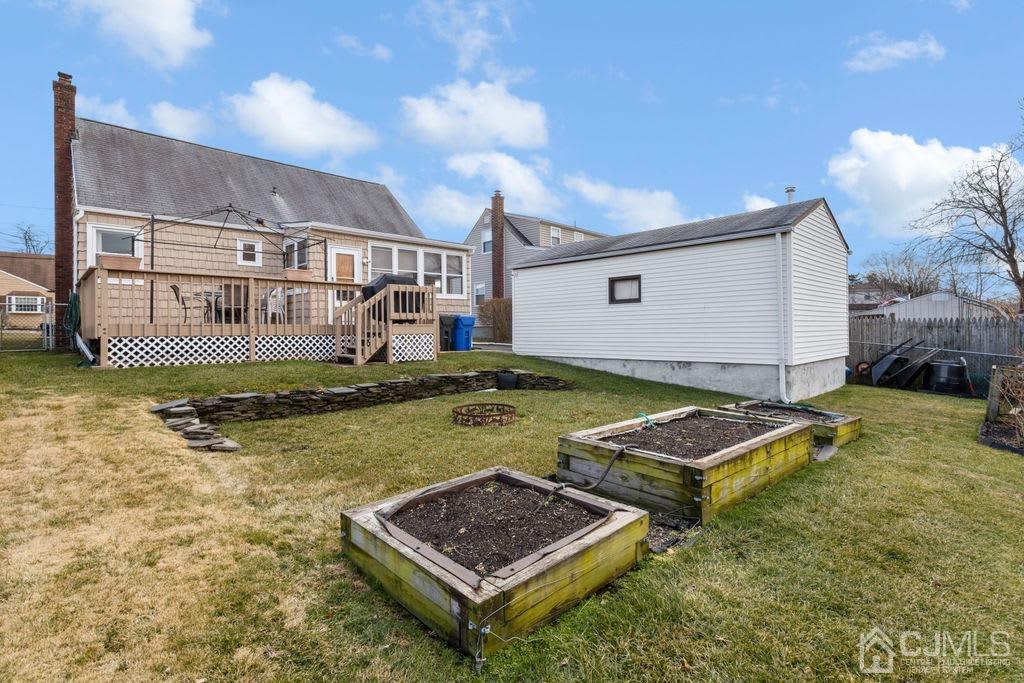 155 East Hill Road Colonia, NJ 07067 - Photo 30 of 37 a view of an house with backyard and sitting area