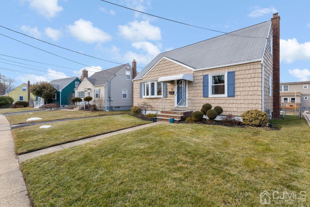 155 East Hill Road Colonia, NJ 07067 - Photo 4 of 37 a front view of a house with a yard
