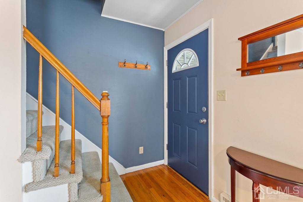 155 East Hill Road Colonia, NJ 07067 - Photo 6 of 37 a view of an entryway with wooden floor