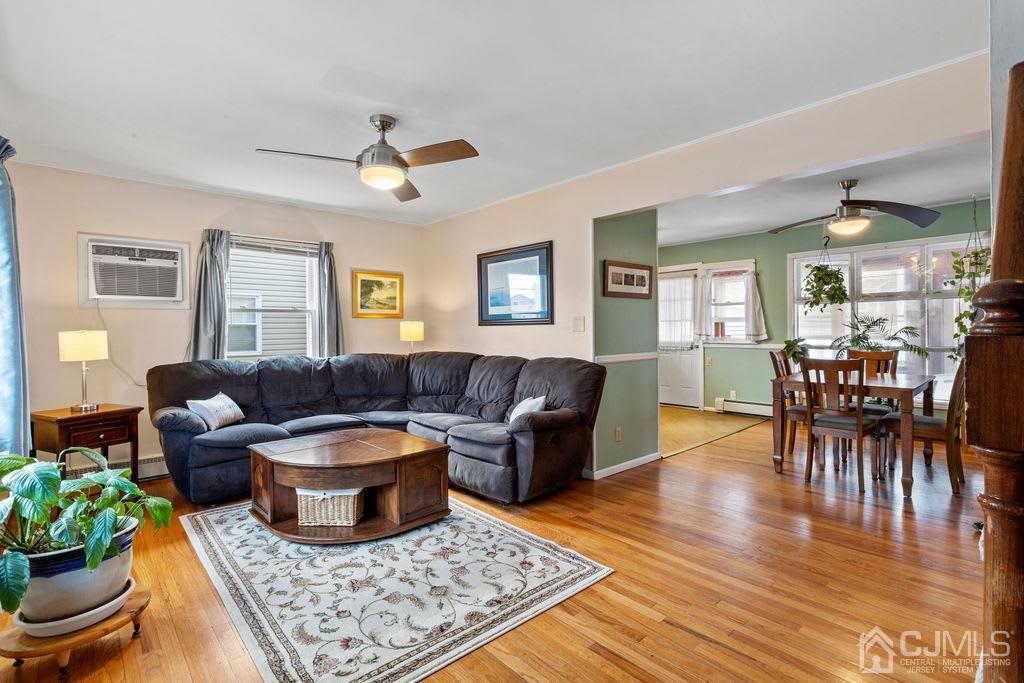 155 East Hill Road Colonia, NJ 07067 - Photo 7 of 37 a living room with furniture and a rug