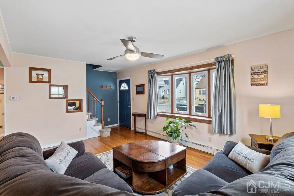 155 East Hill Road Colonia, NJ 07067 - Photo 8 of 37 a living room with furniture and a large window