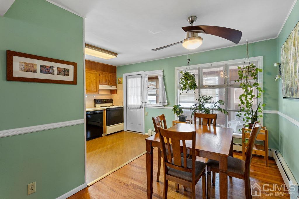 155 East Hill Road Colonia, NJ 07067 - Photo 10 of 37 a view of a dining room with furniture and a chandelier