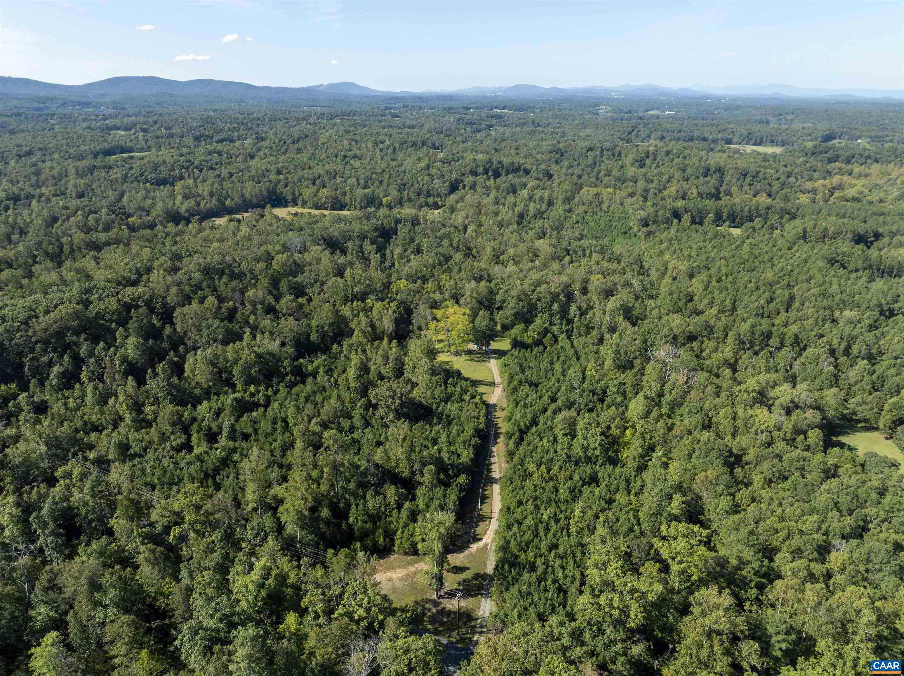 3860-1 Gilbert Station Road Barboursville, VA 22923 - Photo 11 of 14 a view of a city with lush green forest