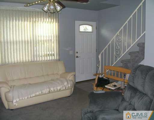 47 Haven Road Old Bridge, NJ 08857 - Photo 5 of 8 a living room with furniture and a chandelier