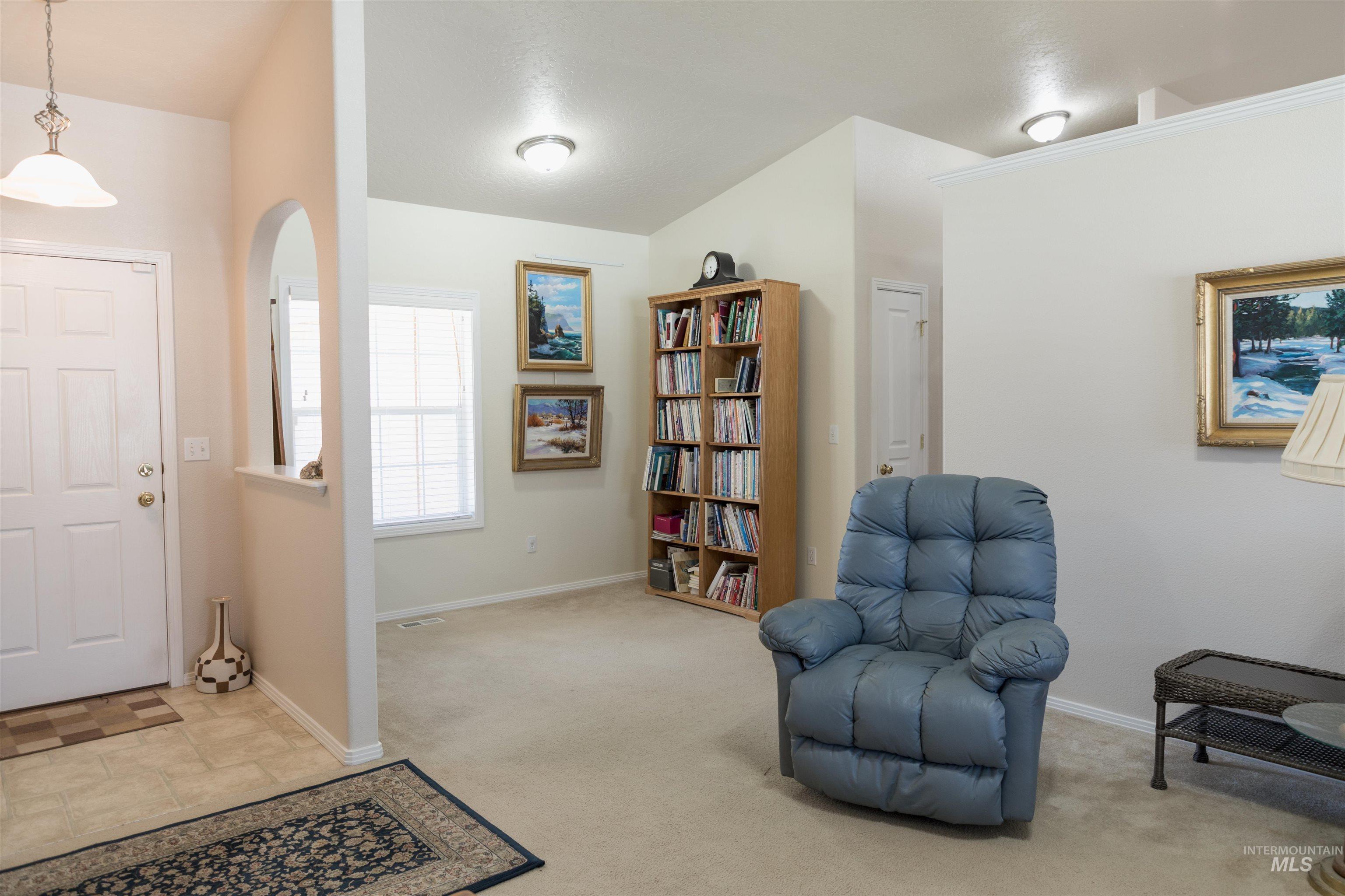 1003 Partridge Street Fruitland, ID 83619 - Photo 18 of 48 Entryway with carpet flooring and stone finish floors