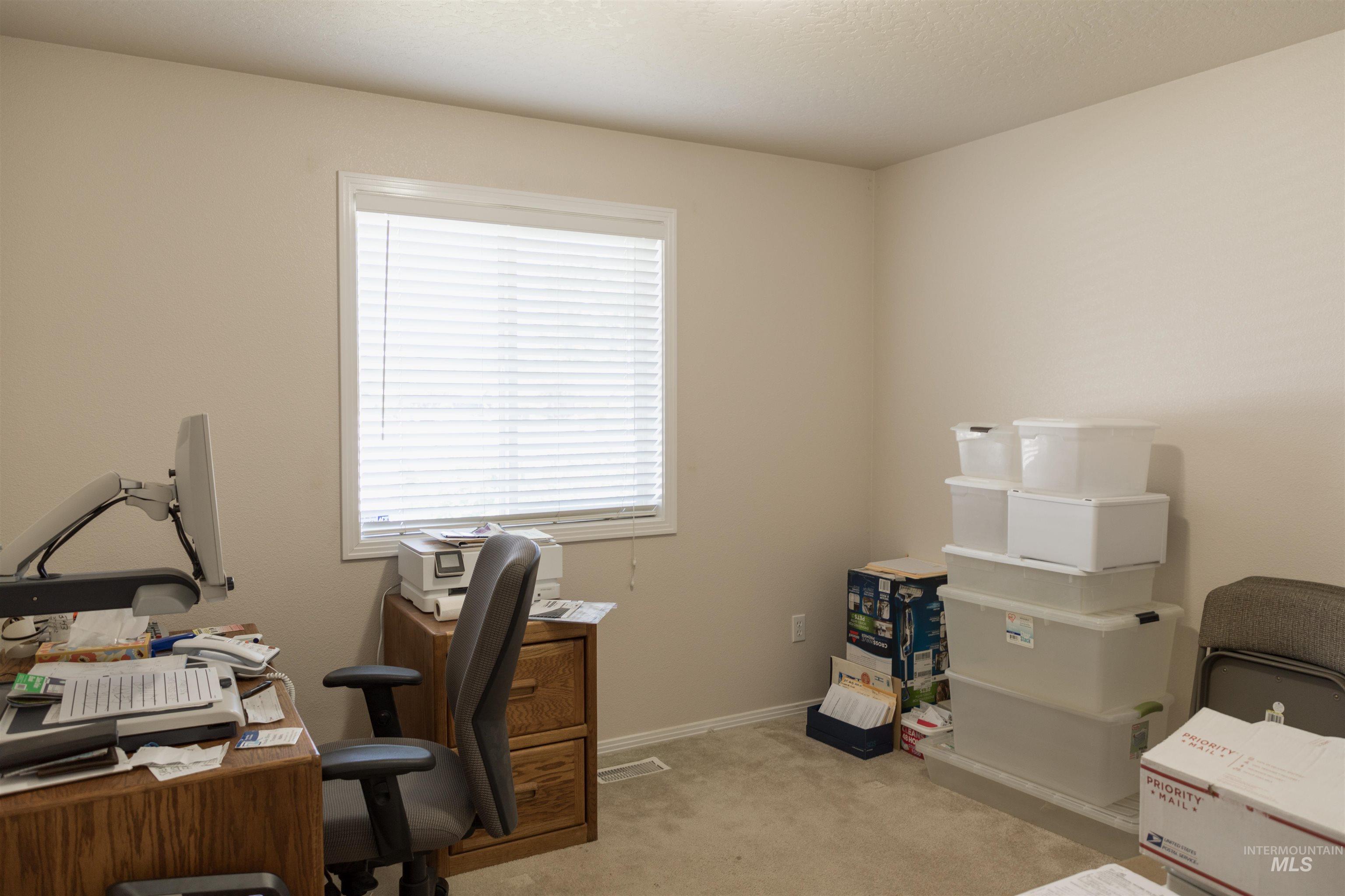 1003 Partridge Street Fruitland, ID 83619 - Photo 2 of 48 Office space featuring light colored carpet and baseboards