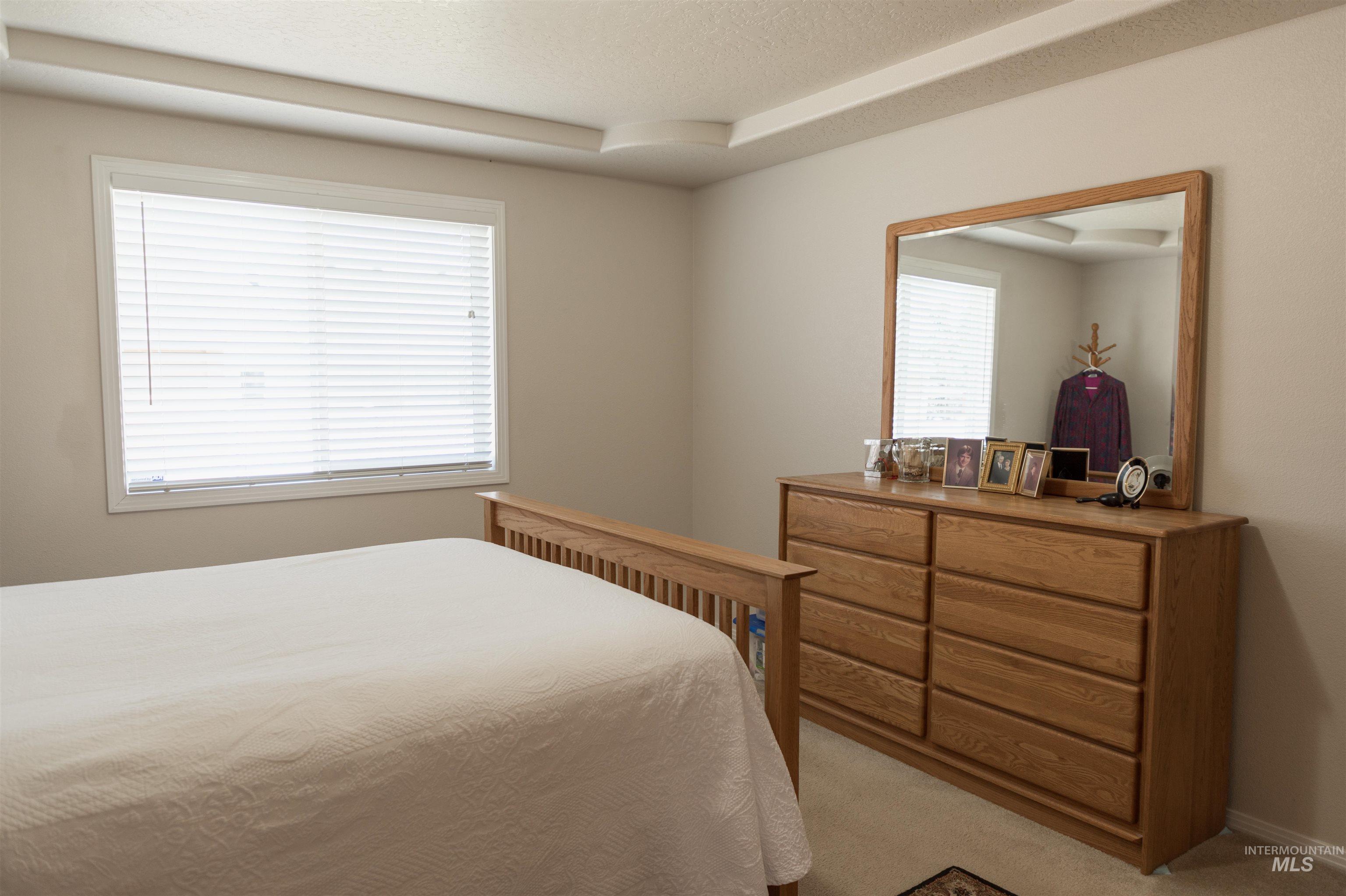 1003 Partridge Street Fruitland, ID 83619 - Photo 24 of 48 Carpeted bedroom featuring a textured ceiling