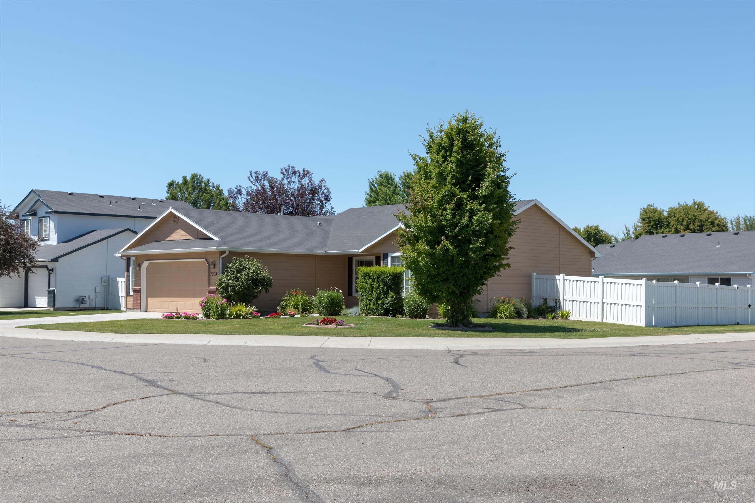 1003 Partridge Street Fruitland, ID 83619 - Photo 39 of 48 Ranch-style house with a garage and driveway