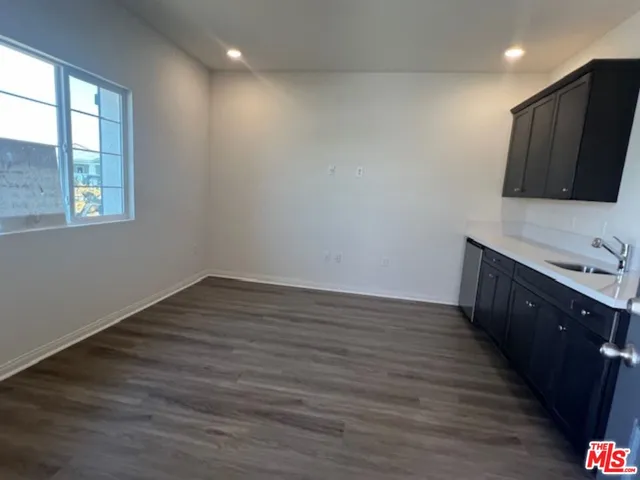 a view of a kitchen from the hallway