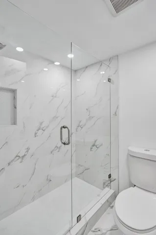 a view of a refrigerator in kitchen