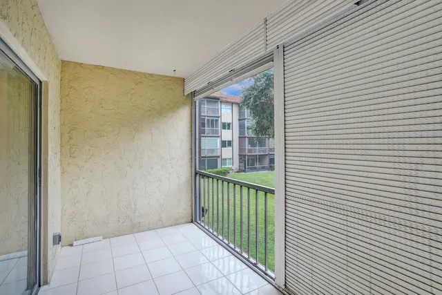 a bathroom with a shower and a glass door
