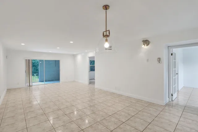 a view of an empty room and window