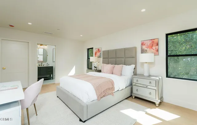 a large white bed in a white room