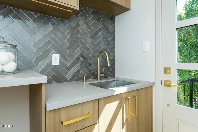 a spacious bedroom with a bed and a view of living room